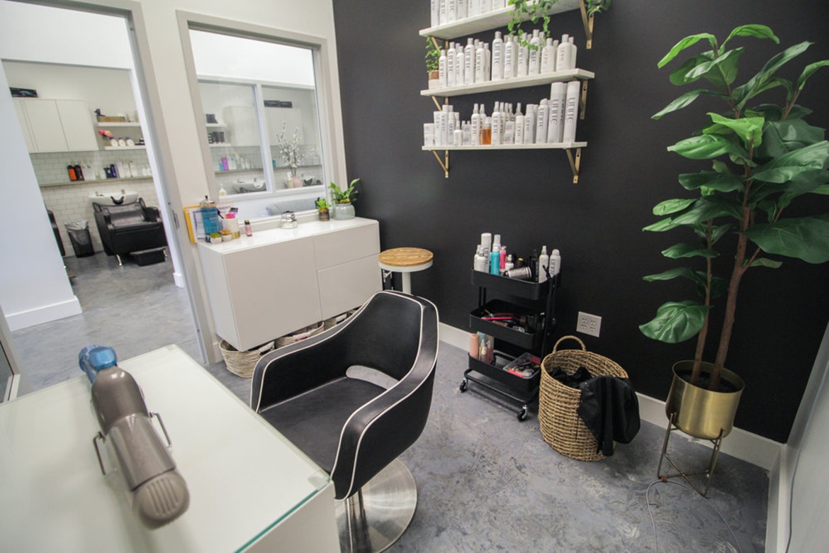 hair salon booth with black wall 