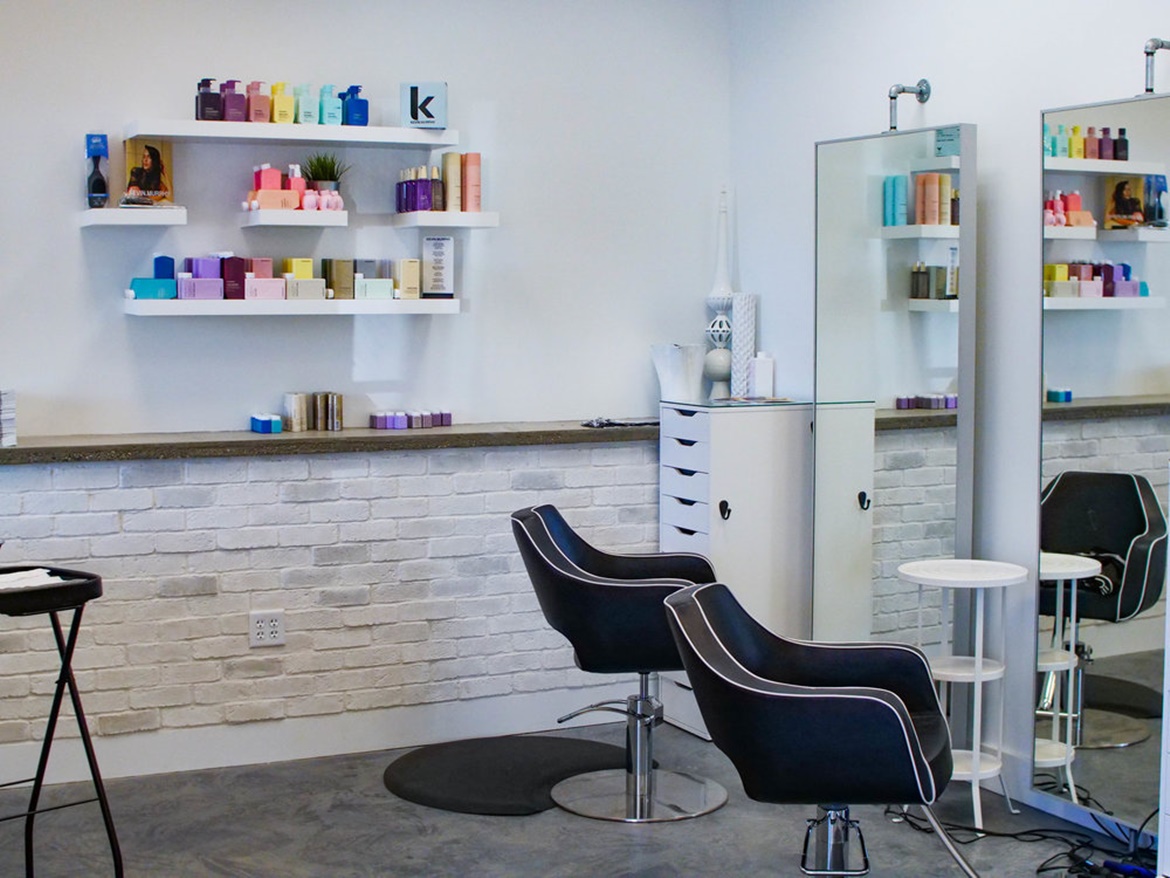 black salon chair and products on shelf