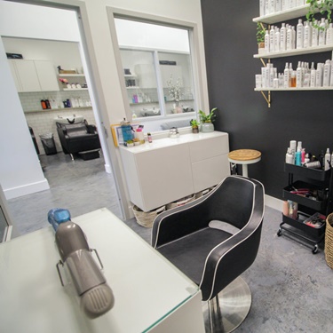 hair salon booth with black wall 
